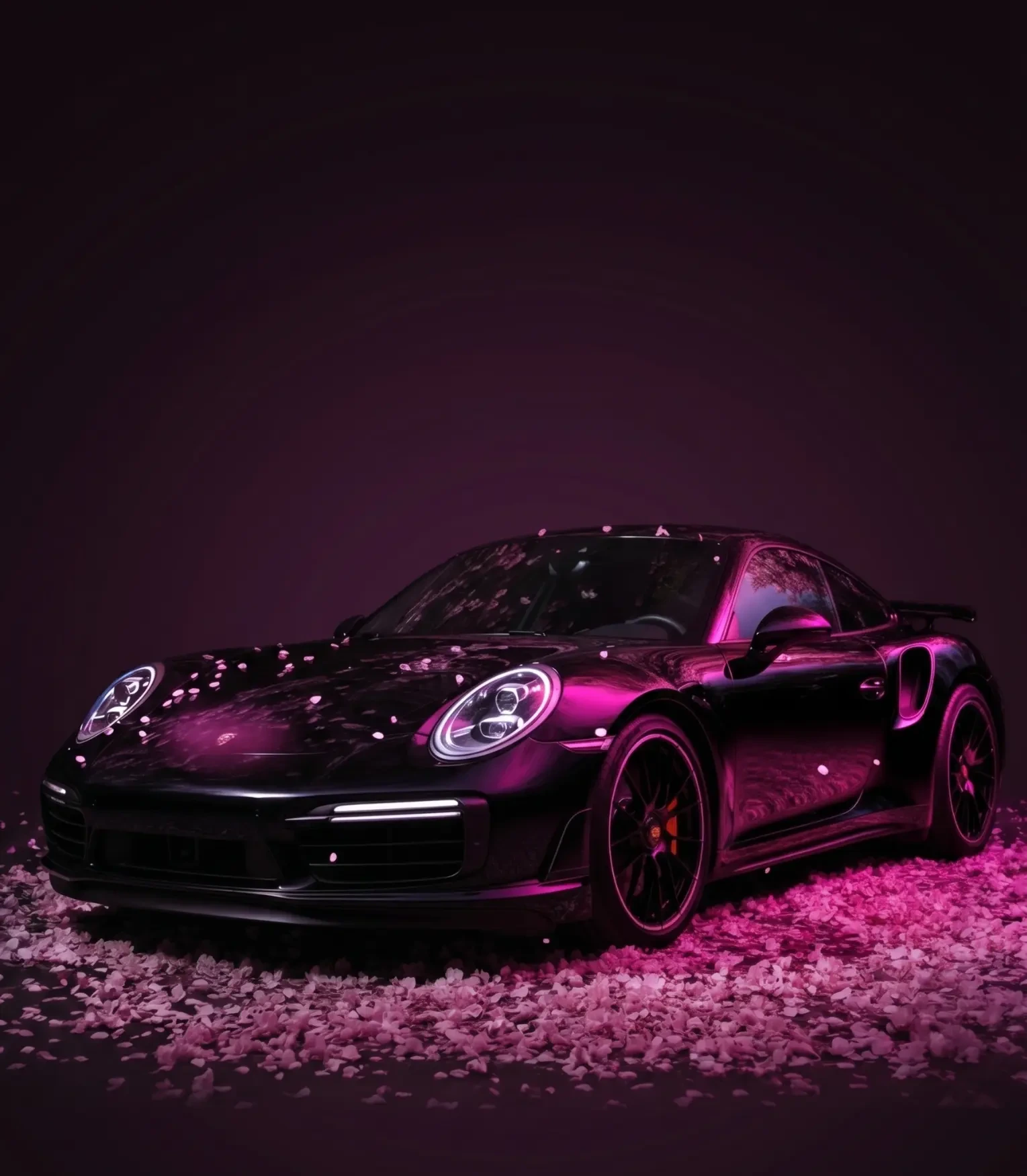 Black Porsche sports car with pink lighting and cherry blossoms