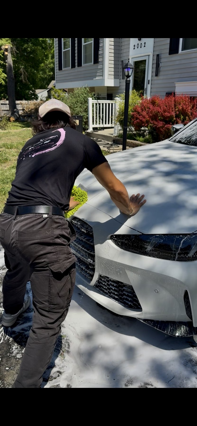 Clean AF technician detailing a vehicle exterior